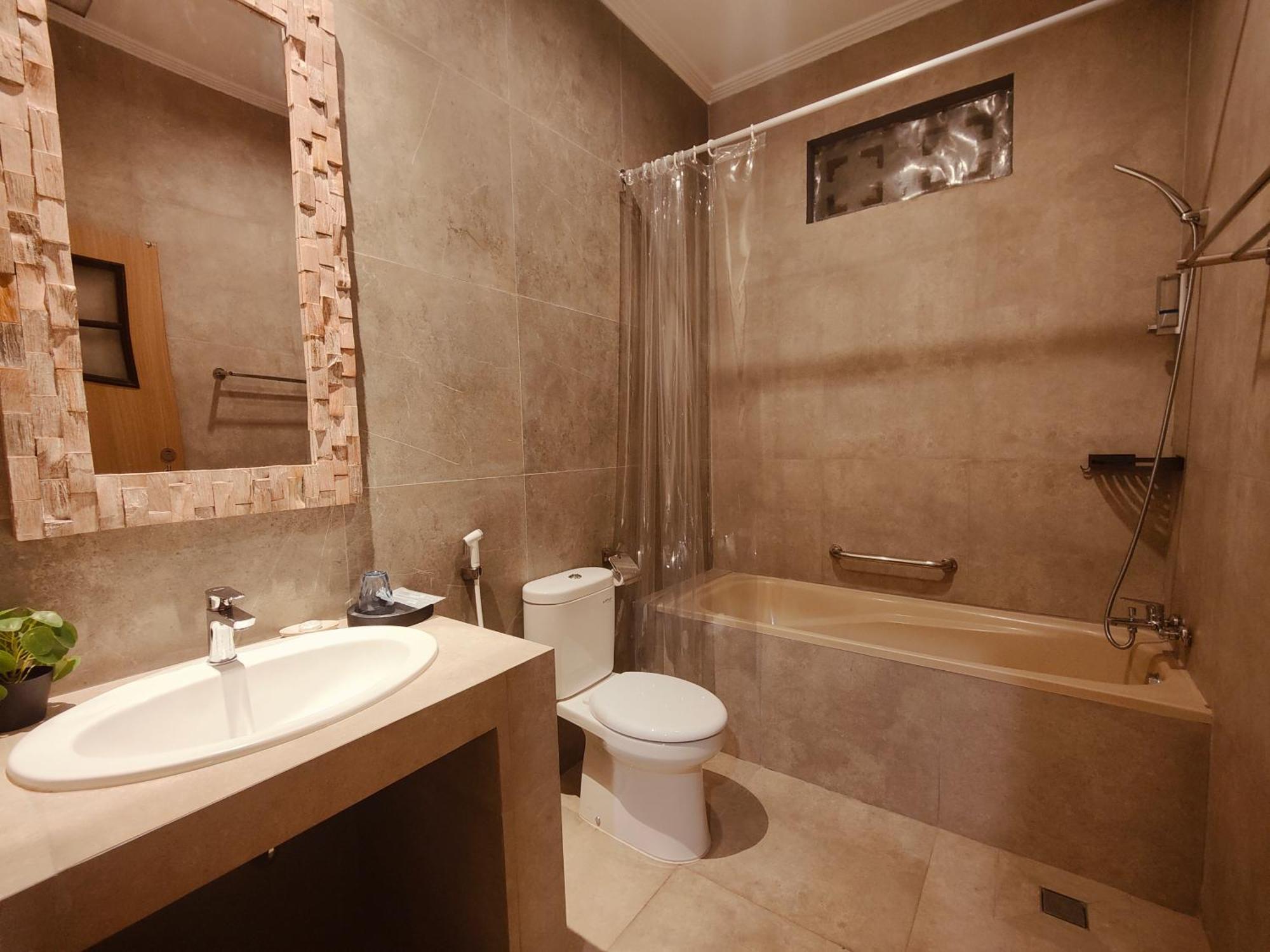 RedDoorz @ Rabasta Kuta Residence Bagian luar foto